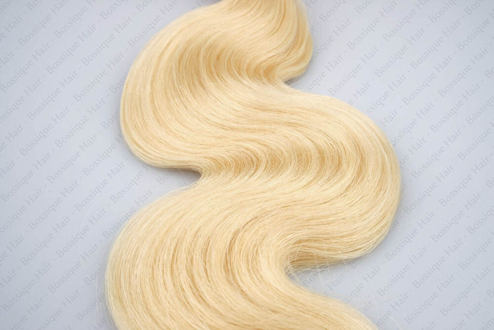 Mid-section of 613 blonde hair displaying the consistent, cascading wave pattern and solid structural health