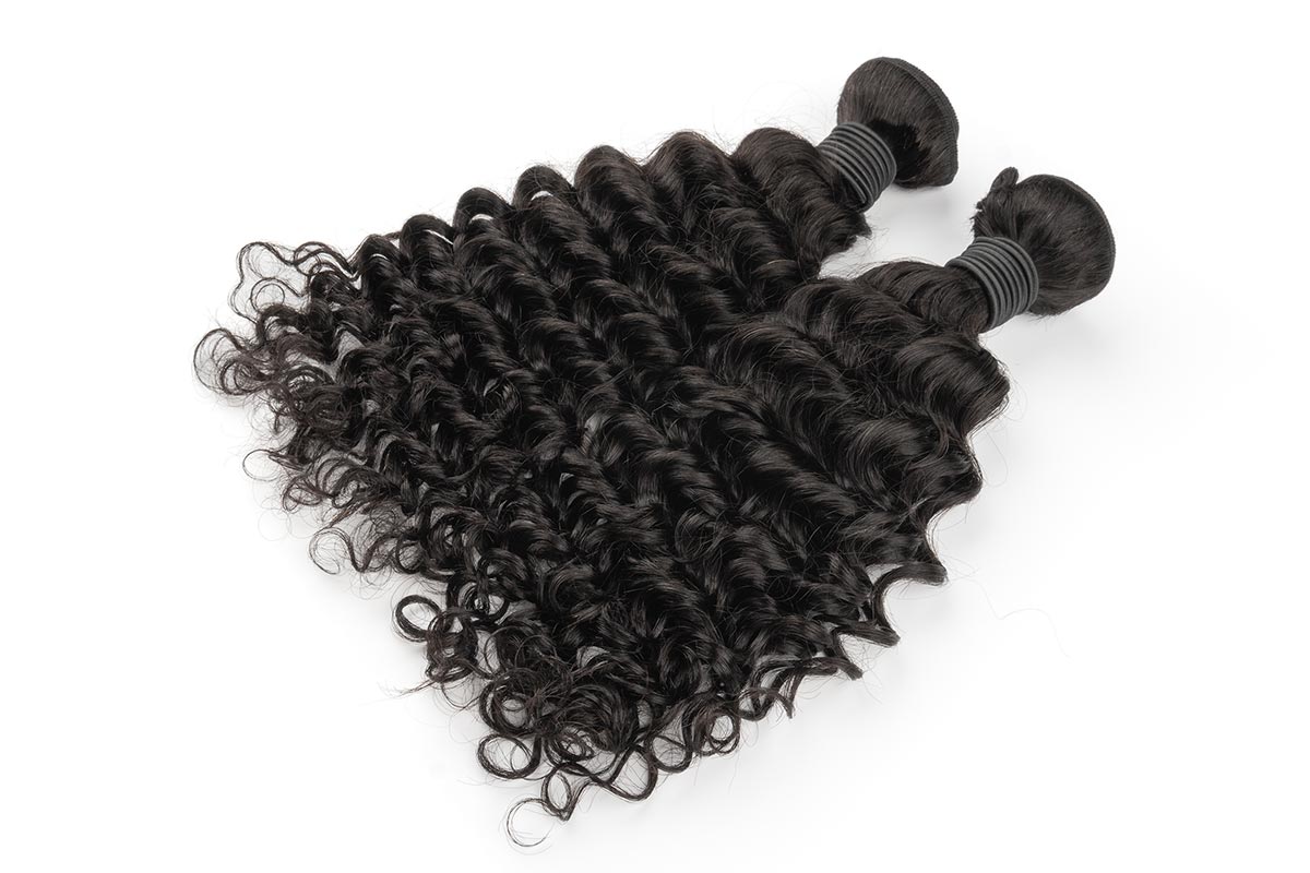 Dynamic view of two French Curly Hair bundles.