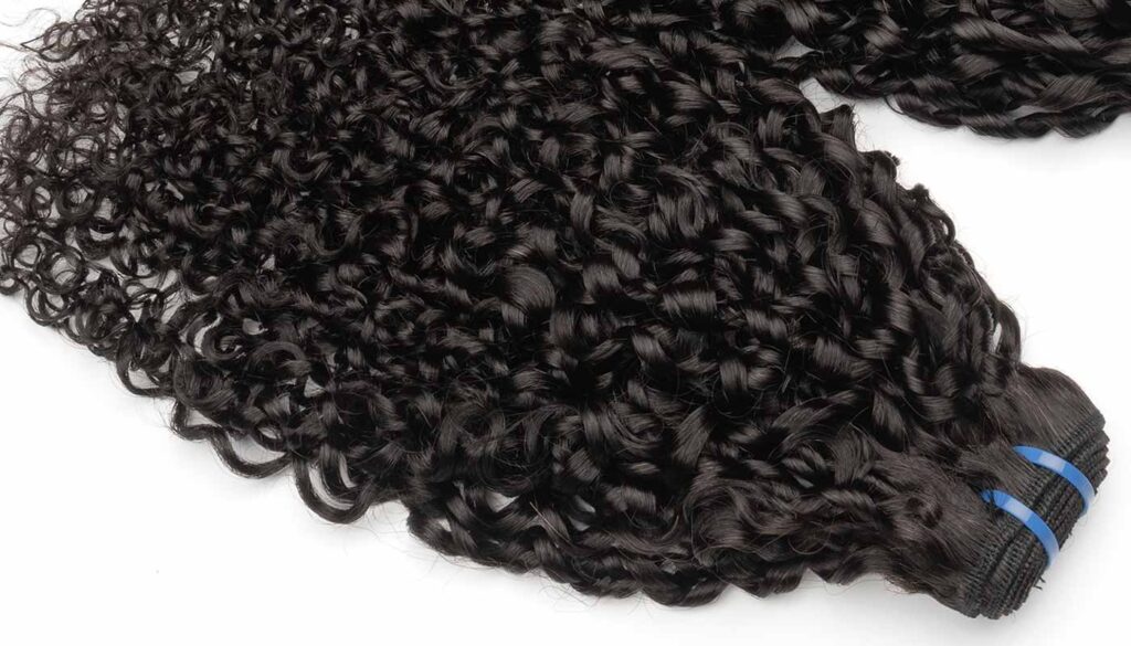 Double-Drawn Pixie Curl 12A hair bundles with defined curls.