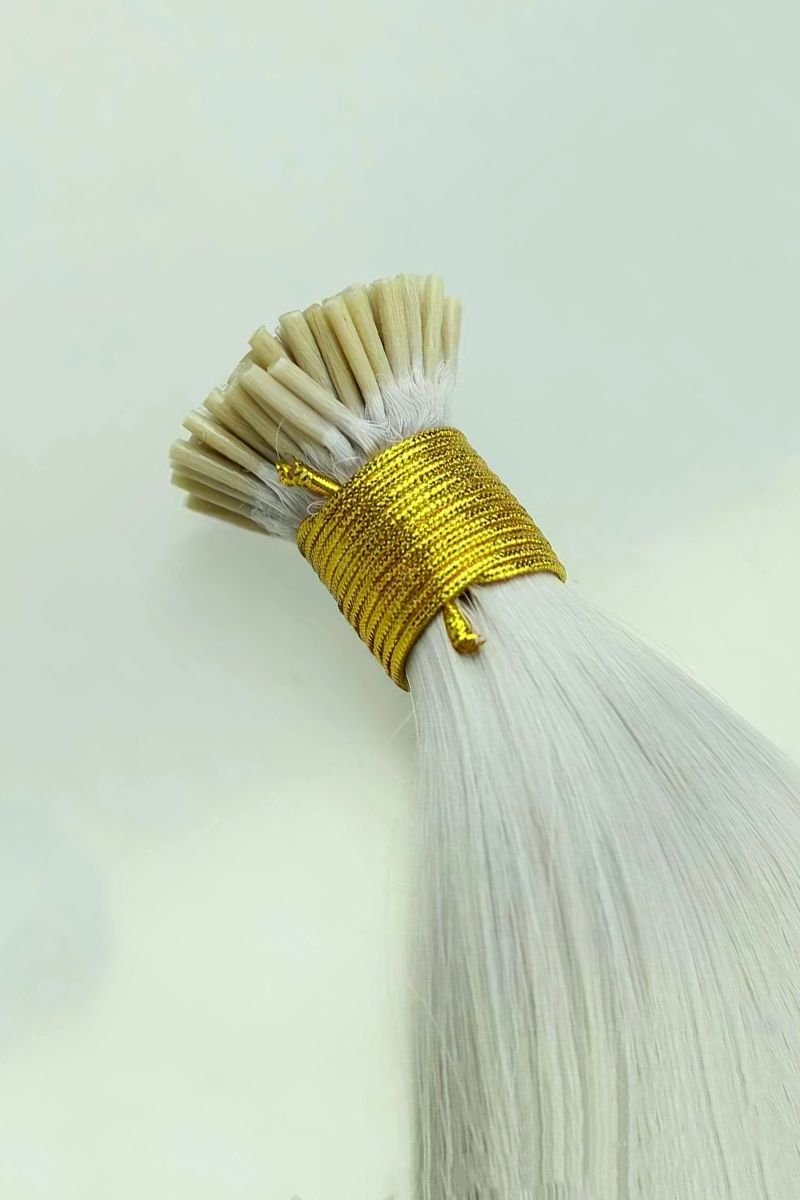 Platinum blonde I-Tip Hair Extensions on display.