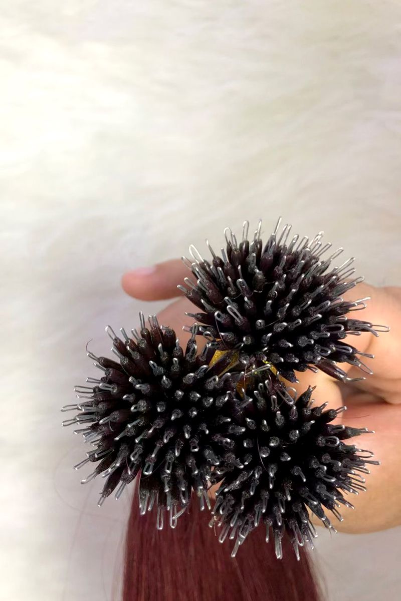 Close-up view of nano rings used in hair extensions.