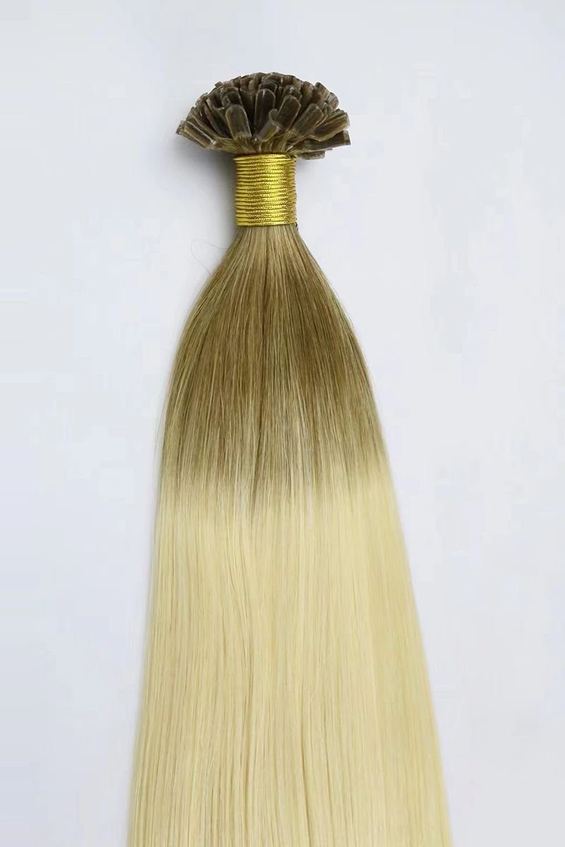Light blonde U-Tip Extensions with light brown roots displayed.