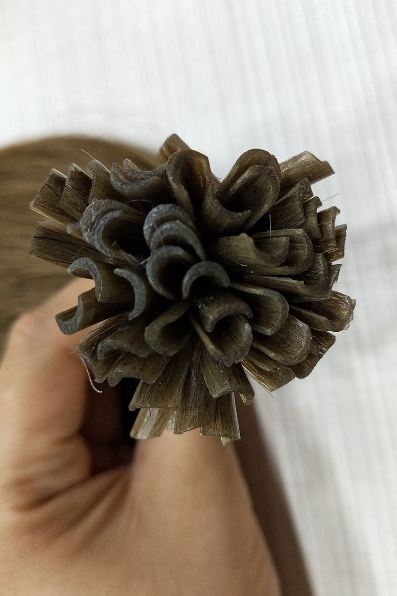 Close-up of the keratin bonds on brown U-Tip Extensions.