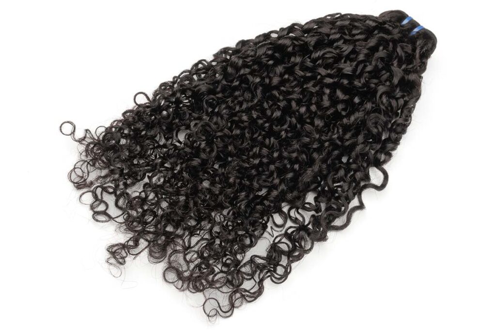One bundle of double-drawn pixie curl hair from the Black Line collection.