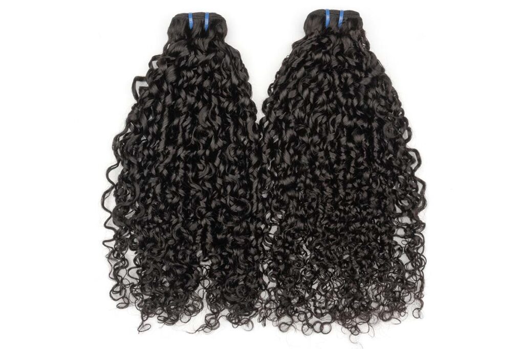 Two bundles of Black Line pixie curl hair extensions displayed together.