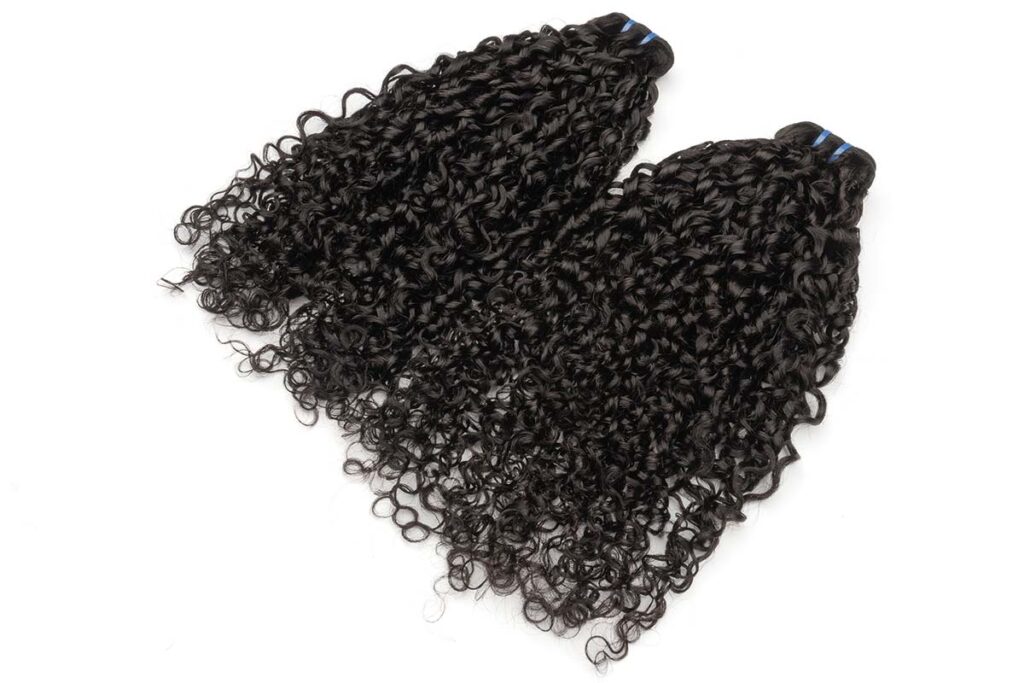 Two Black Line double-drawn pixie curl bundles arranged side by side.