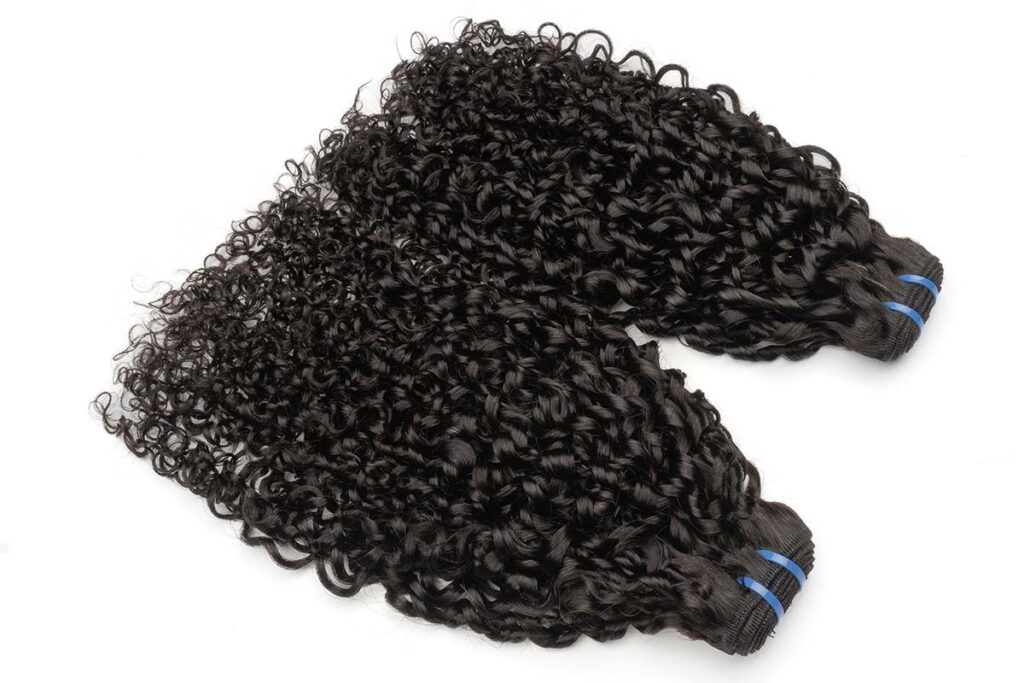 A pair of double-drawn pixie curl hair bundles from the Black Line series.