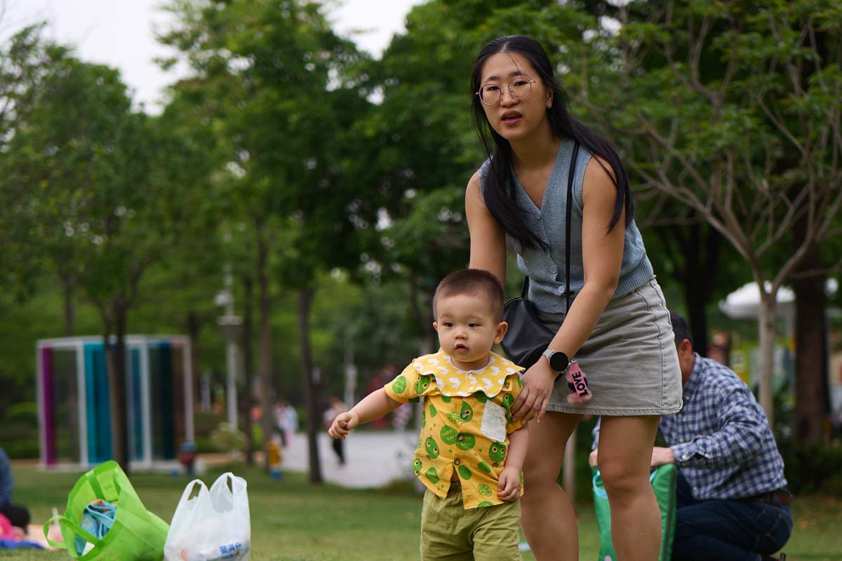 Comparison of natural Asian hair colors, showing off-black hair next to a naturally lighter dark brown Color 2.