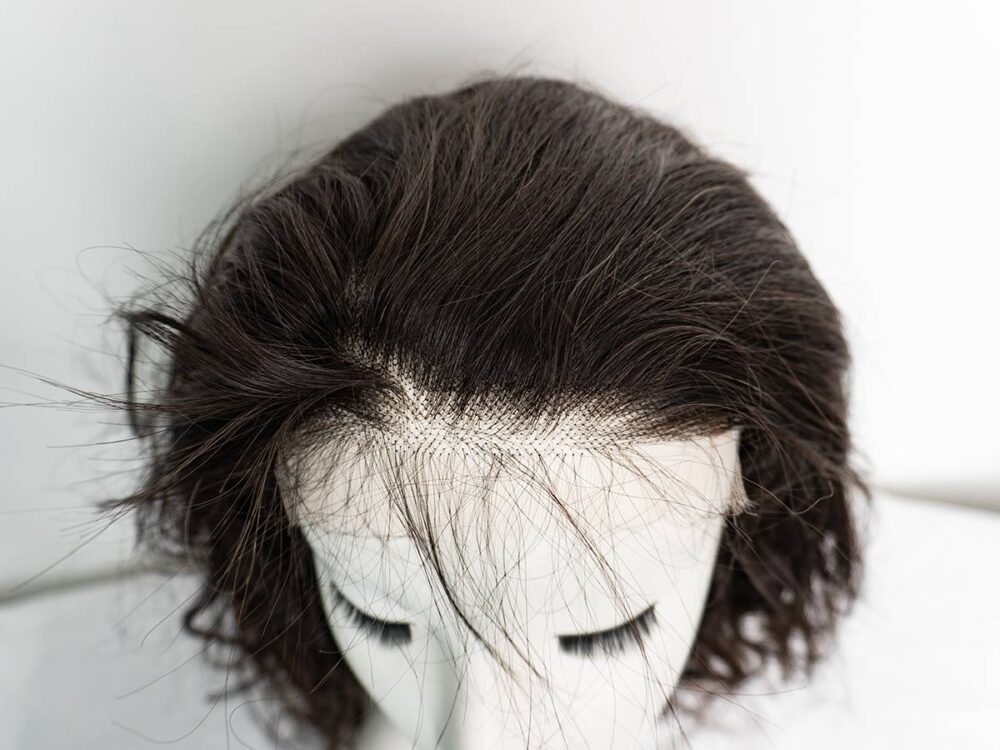 Closeup of a HD lace closure on a customized wig