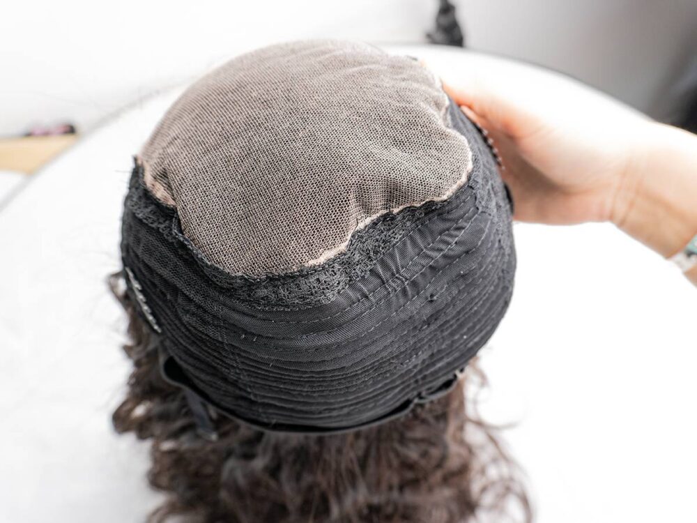 Close-up of the lace and stitching on a 5x5 body wave wig