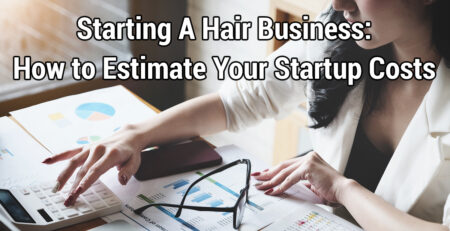 Woman analyzing hair business startup costs with a calculator and paperwork.