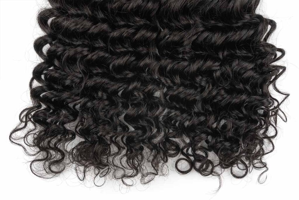 Curly hair bundles with defined, natural curls.