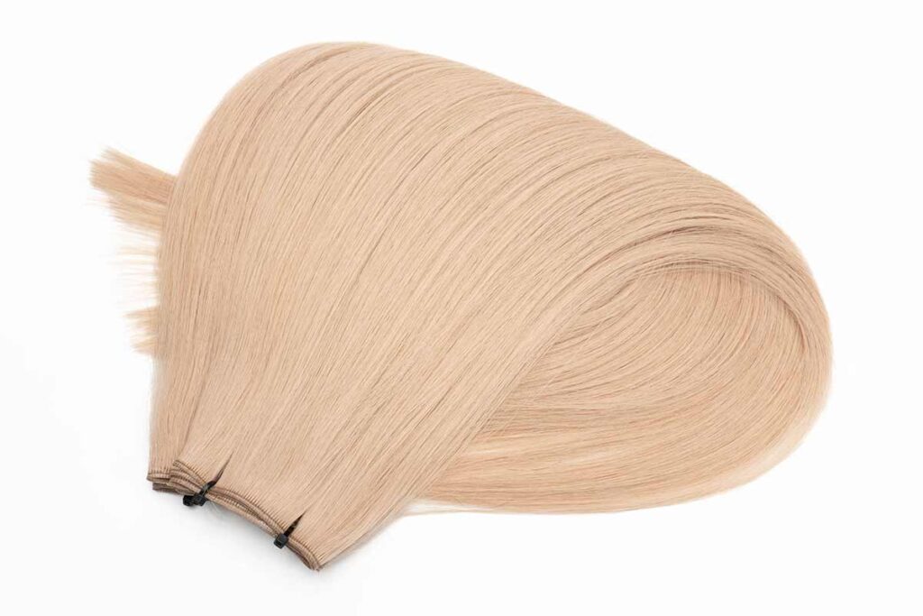 Close-up of double drawn hair weft, color 18a, 18 inches with a 30% fullness ratio, showcasing the even distribution and quality.