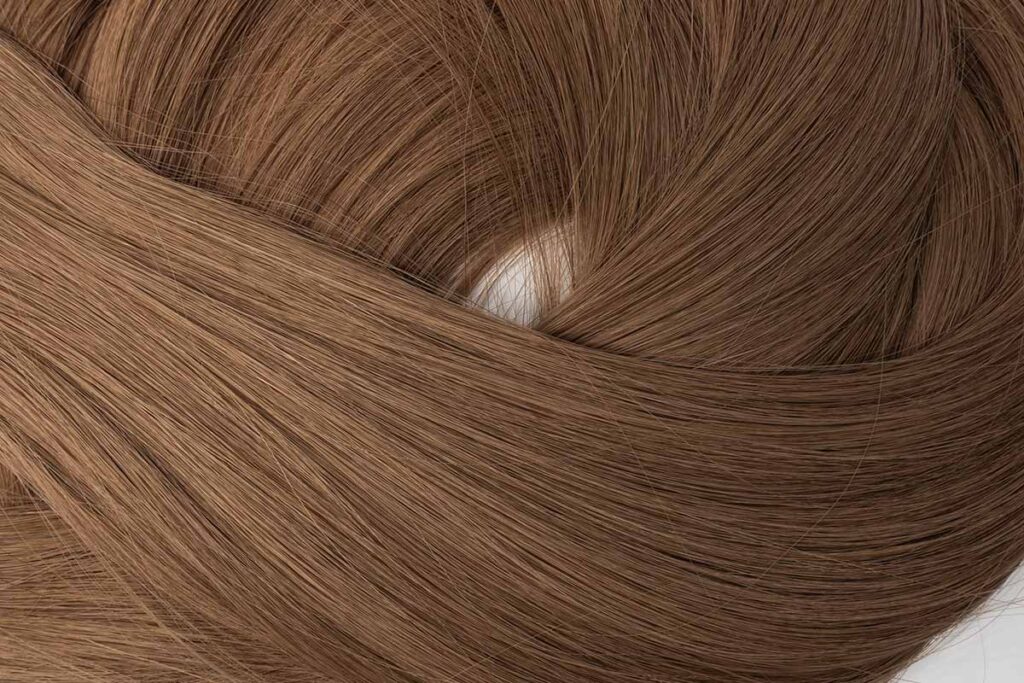 Close-up view of dark brown (color 6) genius weft, 18 inches, highlighting the rich texture and color.
