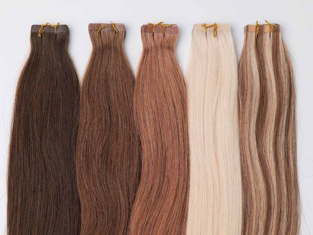 Colored straight tape-in extensions shown from top to bottom with focus on the upper section near the tape tabs.