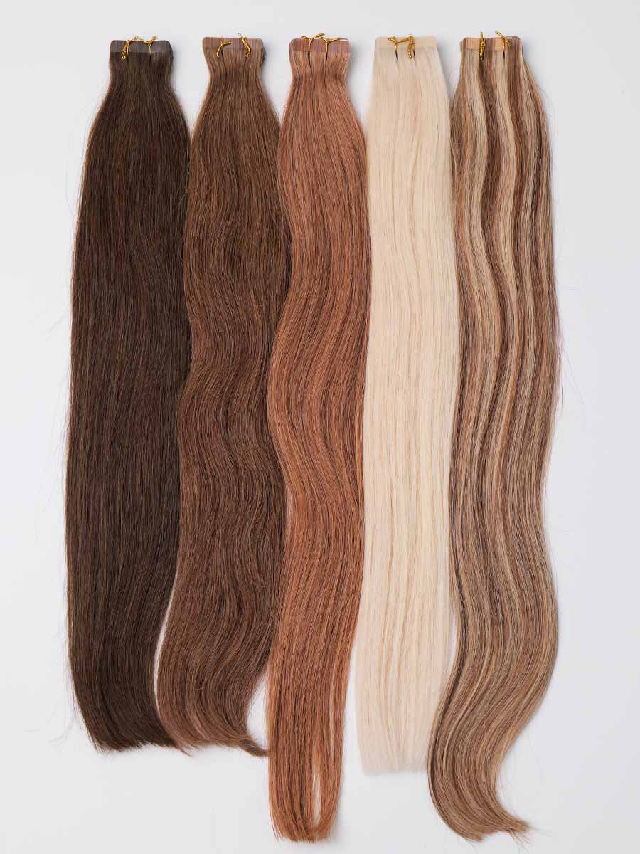Full view of colored straight tape-in extensions showing entire length from tape tabs to ends.