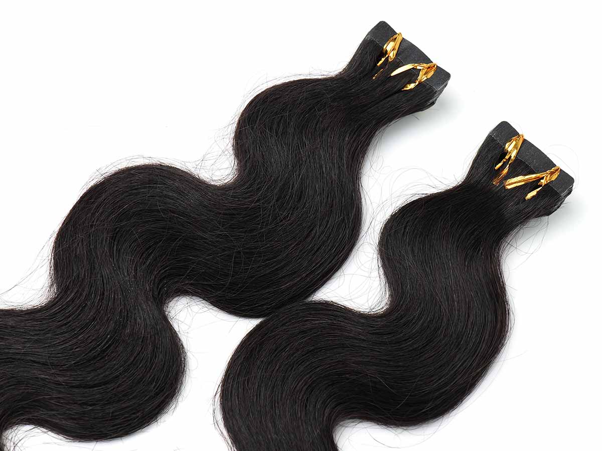 Angled image focused on the tape area of two body wave tape-in bundles, showing clean tab placement.