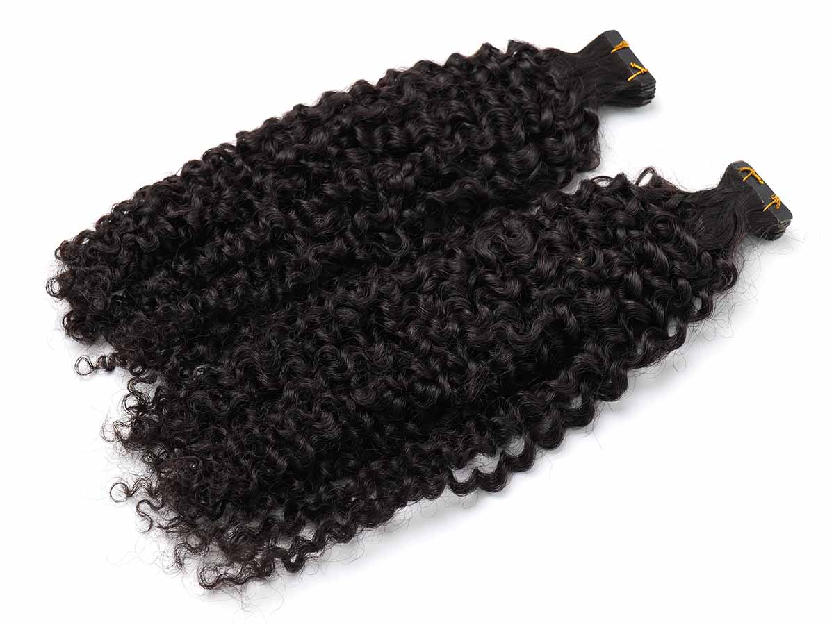 Angled view of two jerry curl tape-in extension bundles with ends facing forward, showing curl tips.