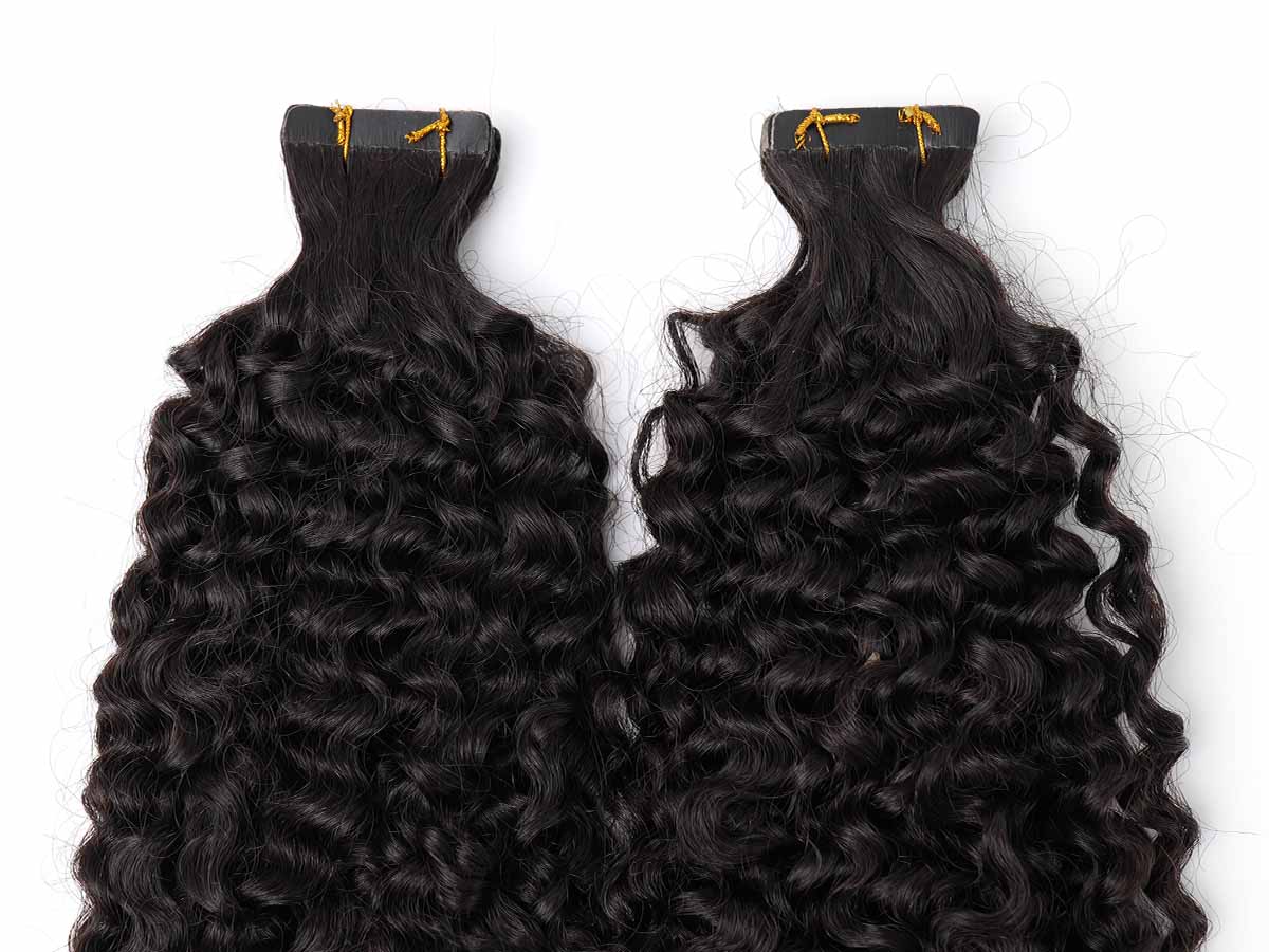 Detailed image of the tape tabs on jerry curl tape-in extensions, highlighting structure and spacing.