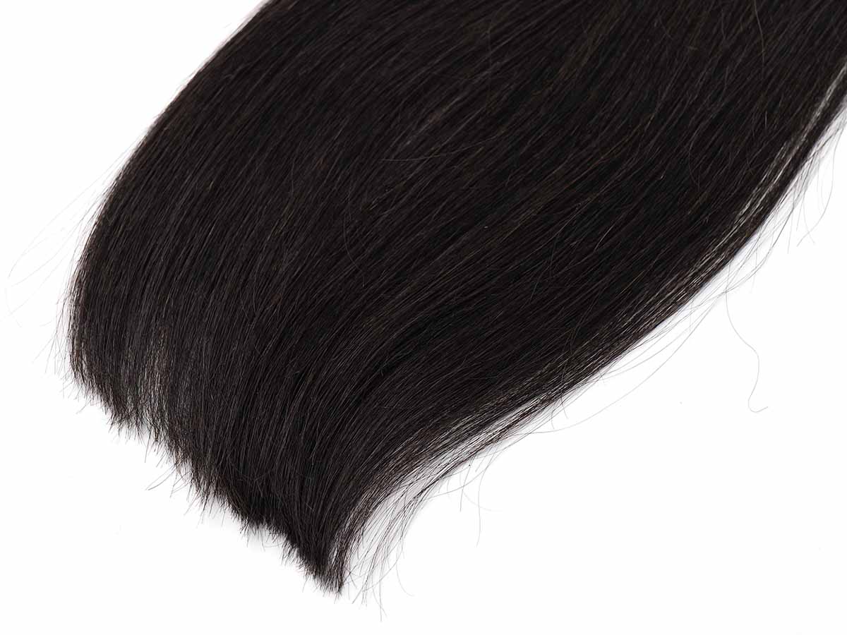 Black Line Straight Tape-In Extensions, 2 pieces, 50g, straight texture on a plain surface.