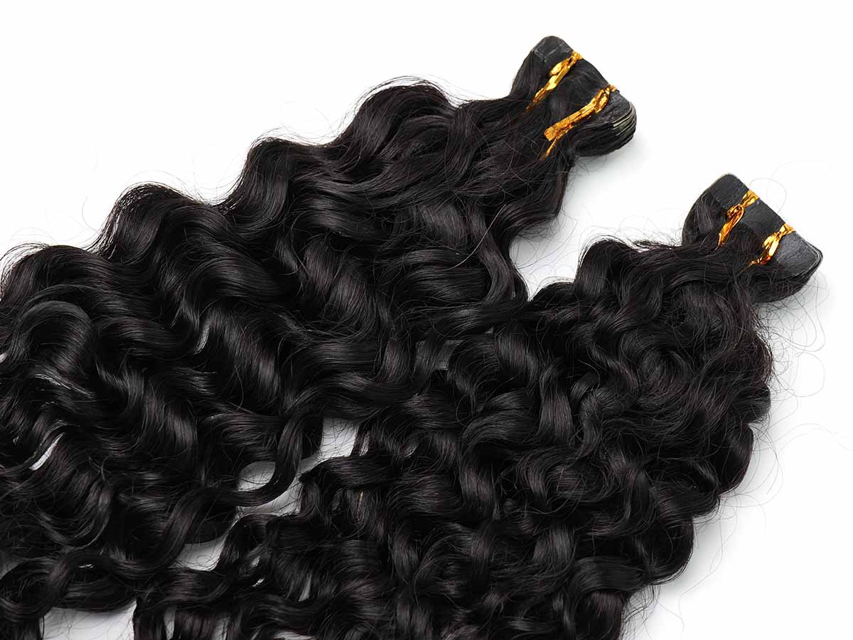 Top-down view of water wave tape-in extensions, focusing on the upper section near the tape tabs.